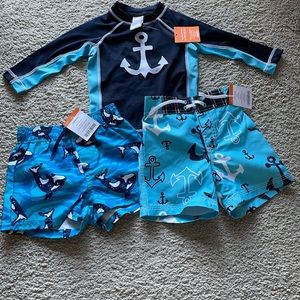 NWT Gymboree boys 6-12 months swimwear. two pairs of trunks & one shirt.